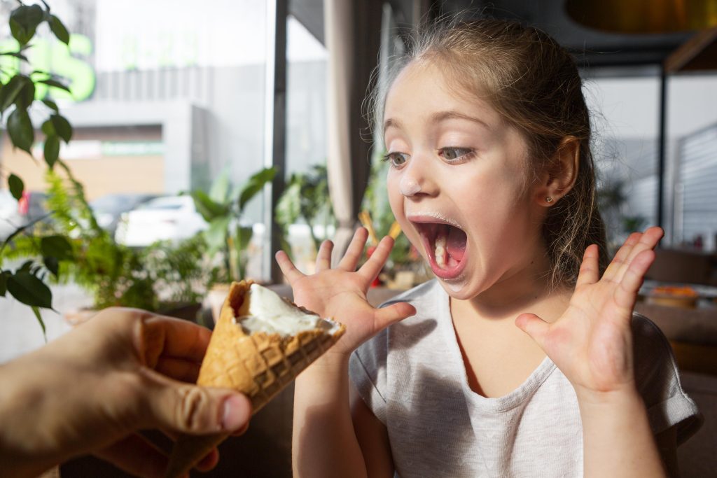 Child uses ADHD impulse control strategies to wait for ice cream