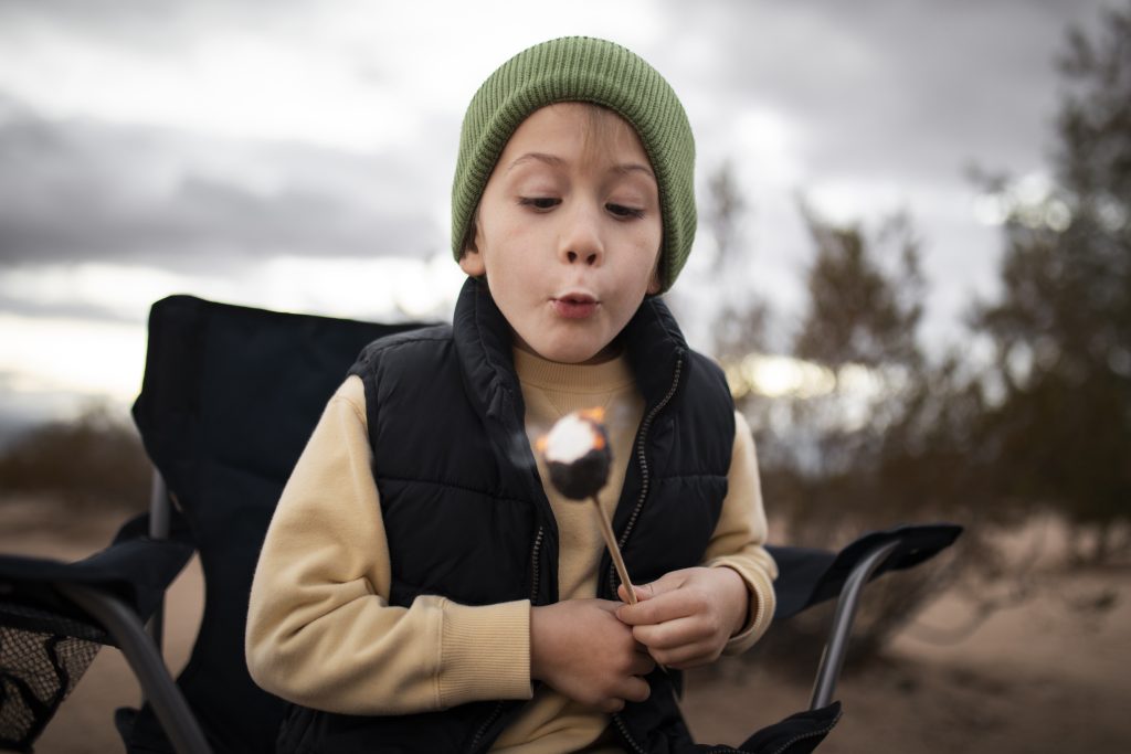 Kid blows out burning toasted marshmallow