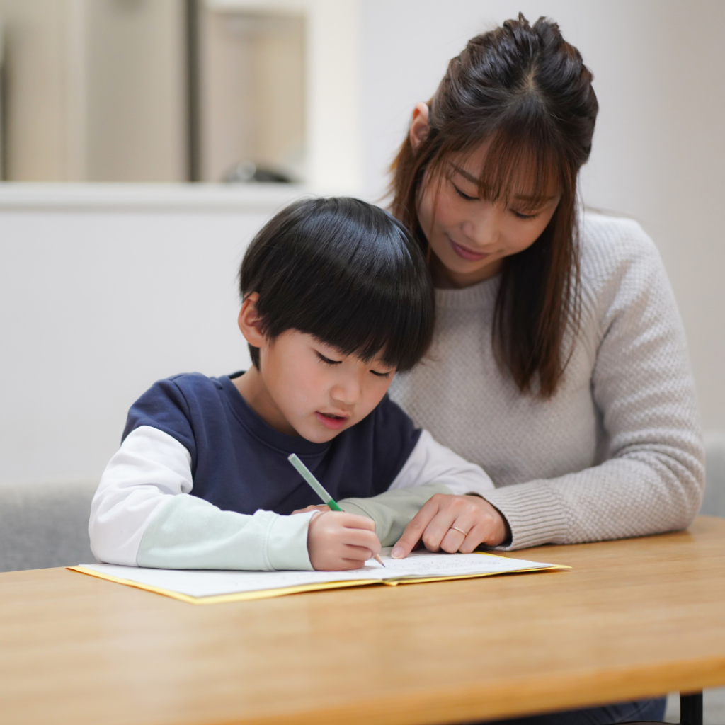 Mom and child body double to complete school work