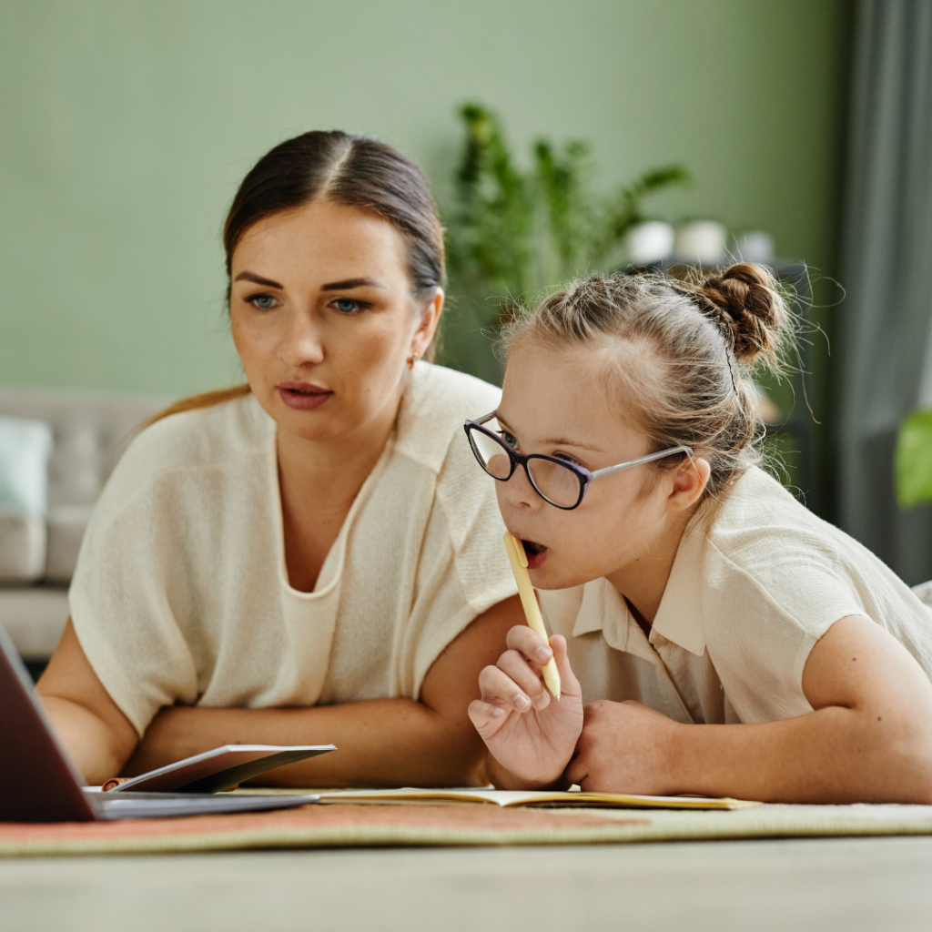 Mother and child work on computer together
