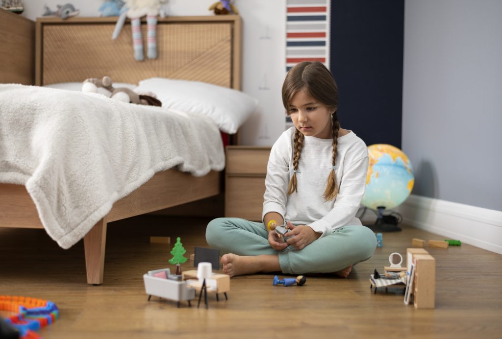 Young girl plays in a tidy room