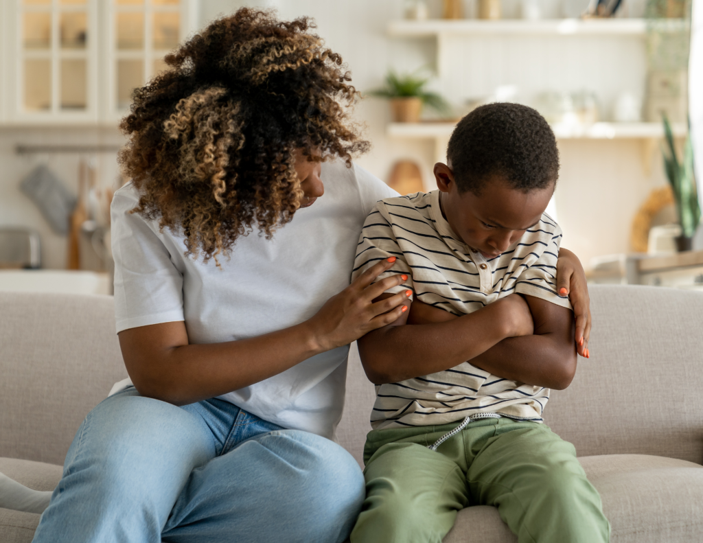 Kid struggles in school mom comforts him