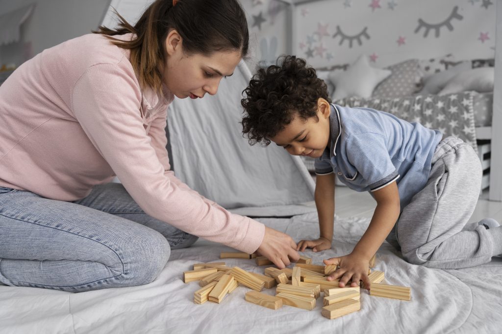 Reasons to homeschool: neurodivergent child learns with blocks with his mother
