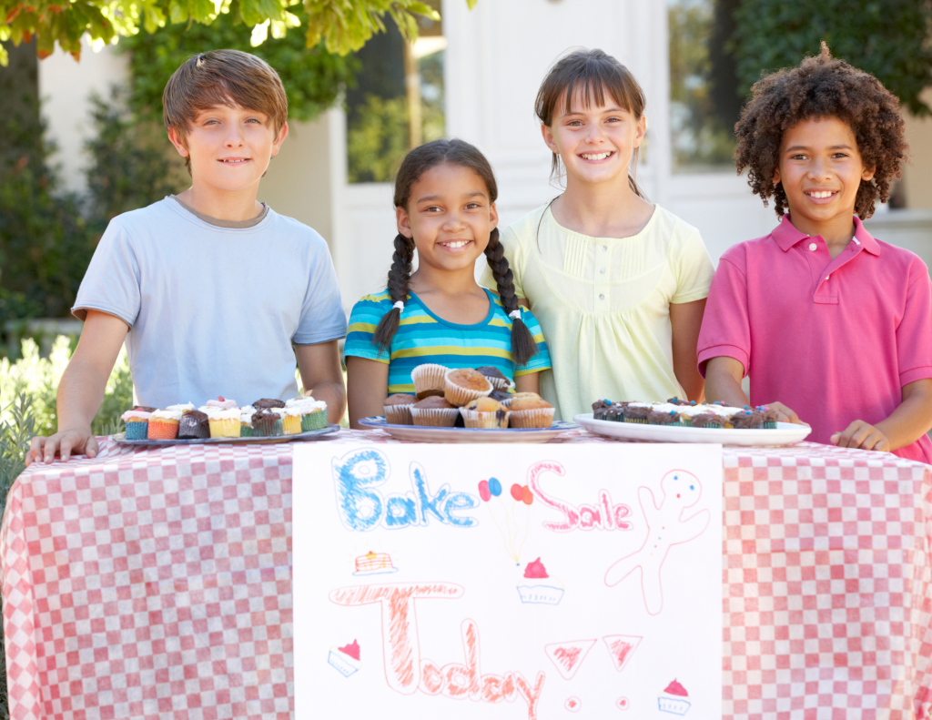 kids running a bake sale