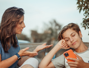 mom talks while teen looks at phone, not listening